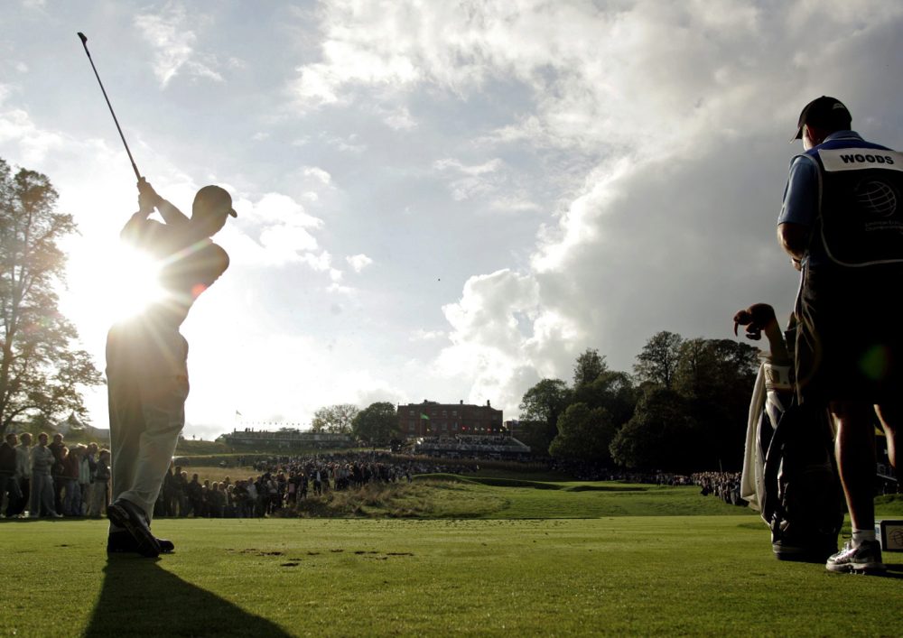 Tiger Woods mid-golf shot when pictured, surrounded by fans.