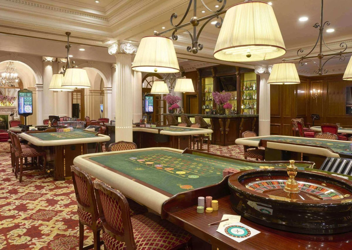 A room containing various gaming tables such as roulette