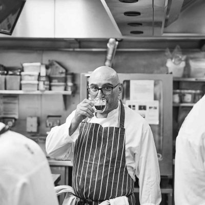 A chef having a coffee in the kitchen